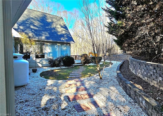 view of yard featuring a wooden deck