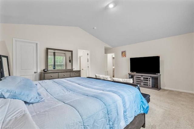 carpeted bedroom featuring lofted ceiling and baseboards