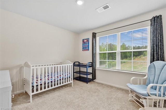 carpeted bedroom featuring baseboards