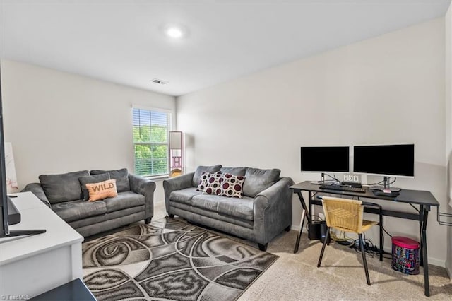 living room with carpet and baseboards