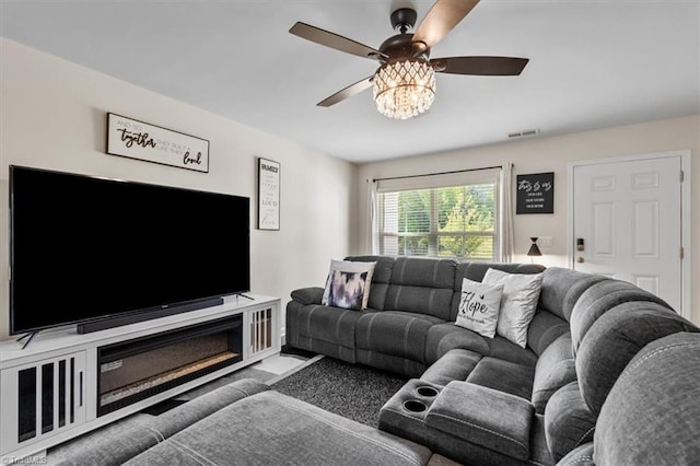 living area featuring a ceiling fan