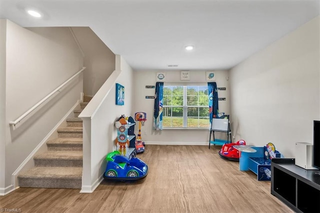 playroom featuring wood finished floors, baseboards, and recessed lighting