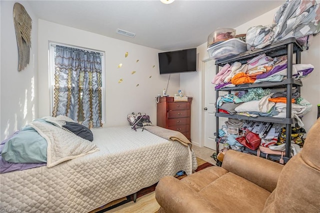 bedroom featuring visible vents and carpet floors