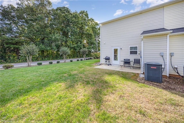 view of yard featuring central AC and a patio