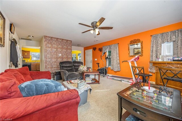 living room with carpet flooring and ceiling fan