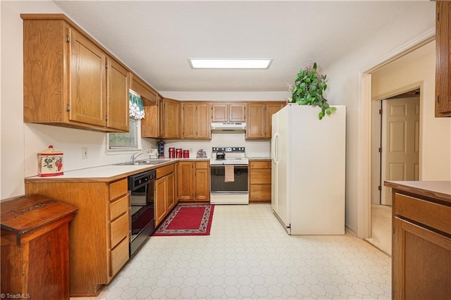 kitchen featuring white appliances and sink