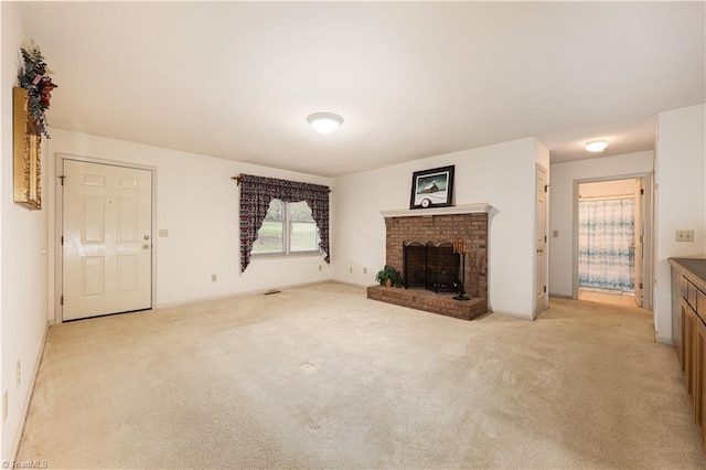 unfurnished living room featuring a fireplace and light colored carpet