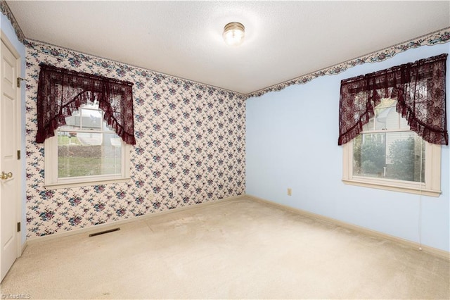 empty room with carpet flooring