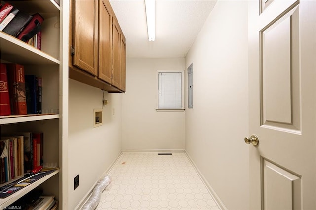 laundry area featuring hookup for a washing machine and cabinets