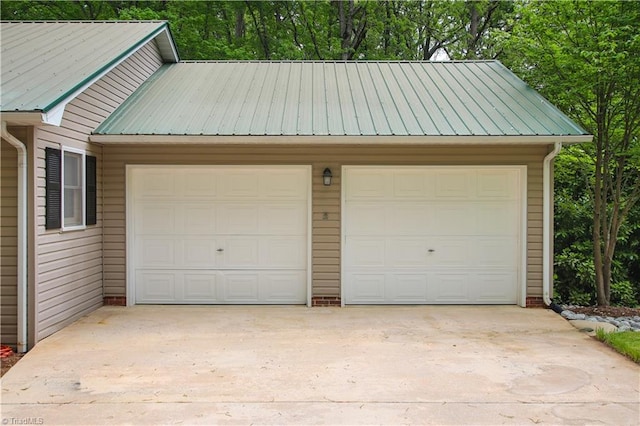 garage featuring wooden walls