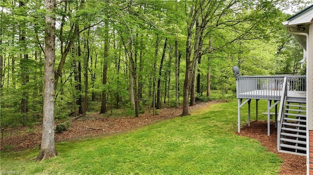 view of yard featuring a wooden deck