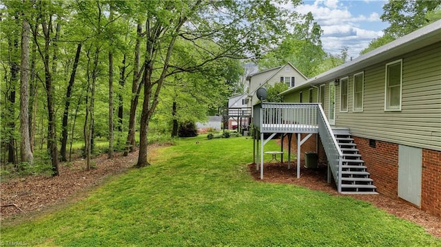 view of yard featuring a wooden deck