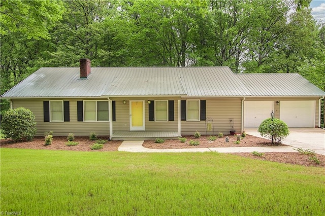 single story home with a front lawn, covered porch, and a garage