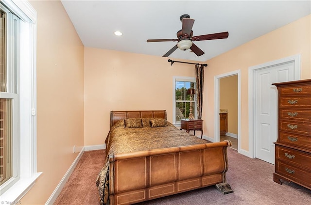 bedroom with carpet, baseboards, recessed lighting, ensuite bathroom, and a ceiling fan