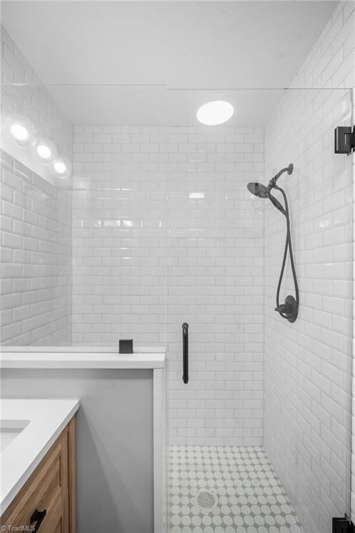 full bathroom with vanity and a shower stall