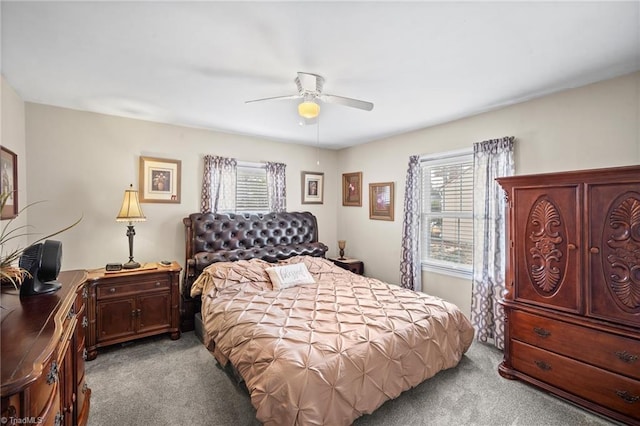 bedroom with ceiling fan and light colored carpet