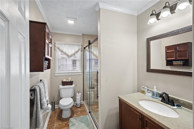 bathroom with toilet, ornamental molding, vanity, a shower stall, and a textured ceiling