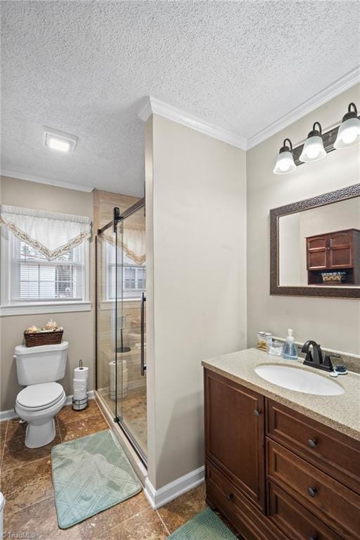 bathroom featuring toilet, a textured ceiling, a shower stall, vanity, and baseboards