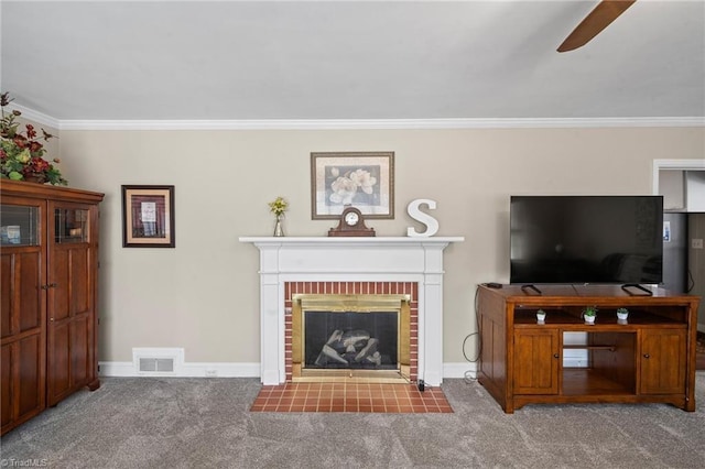 carpeted living room featuring a brick fireplace, visible vents, crown molding, and baseboards