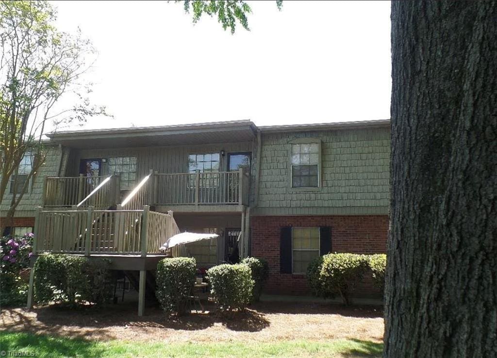 back of house with a balcony