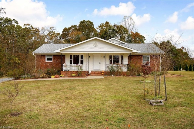 ranch-style home with a front lawn and covered porch