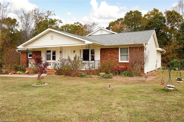 single story home featuring a porch, a front lawn, and roof with shingles