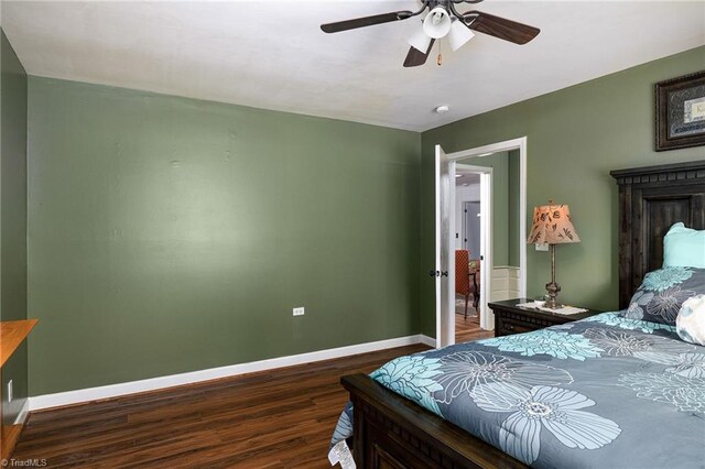 bedroom with dark wood-type flooring and ceiling fan