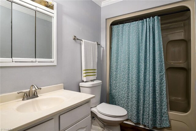 full bathroom featuring toilet, vanity, shower / bath combination with curtain, and ornamental molding