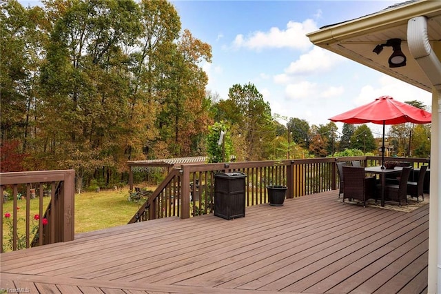 wooden deck with ceiling fan