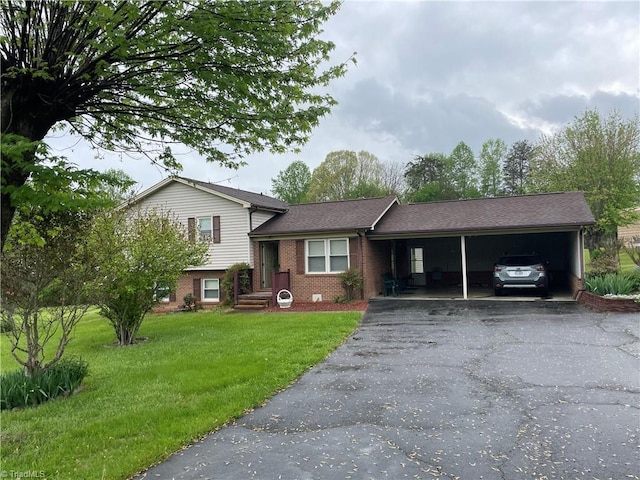 139 Orchard View Dr, Mount Airy, NC 27030 - split level home with brick siding, a front lawn, driveway, and an attached carport