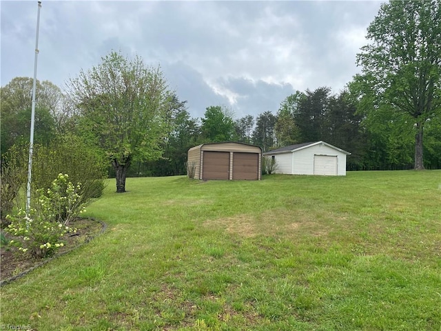 139 Orchard View Dr, Mount Airy, NC 27030 - view of yard with a detached garage and an outbuilding