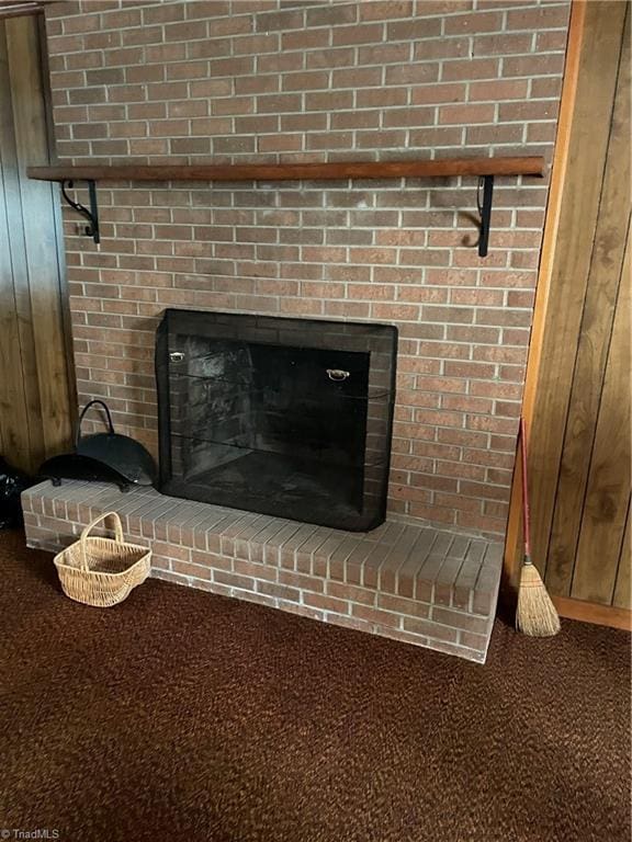 139 Orchard View Dr, Mount Airy, NC 27030 - interior details with a brick fireplace, wood walls, and carpet