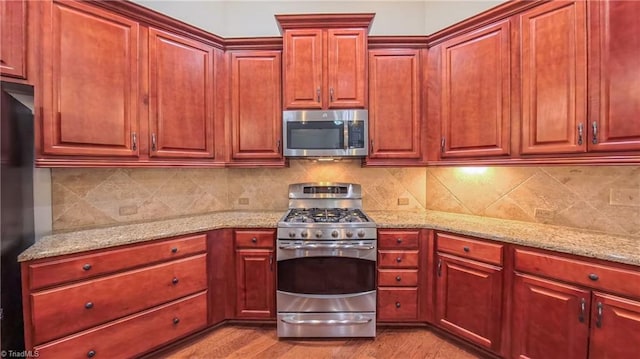 5567 Foxgate Cir, Winston-Salem, NC 27106 - kitchen featuring stainless steel appliances and reddish brown cabinets