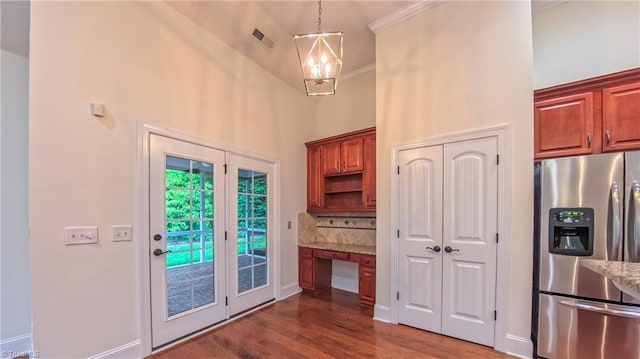 5567 Foxgate Cir, Winston-Salem, NC 27106 - kitchen featuring stainless steel fridge, wood finished floors, a chandelier, light stone countertops, and decorative light fixtures
