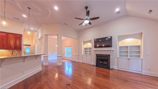 5567 Foxgate Cir, Winston-Salem, NC 27106 - unfurnished living room featuring a ceiling fan, a high end fireplace, dark wood-style floors, built in features, and ornamental molding