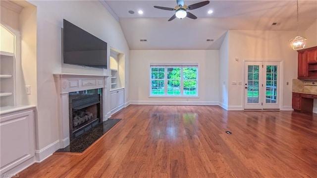 5567 Foxgate Cir, Winston-Salem, NC 27106 - unfurnished living room with a premium fireplace, ceiling fan, wood finished floors, vaulted ceiling, and built in features