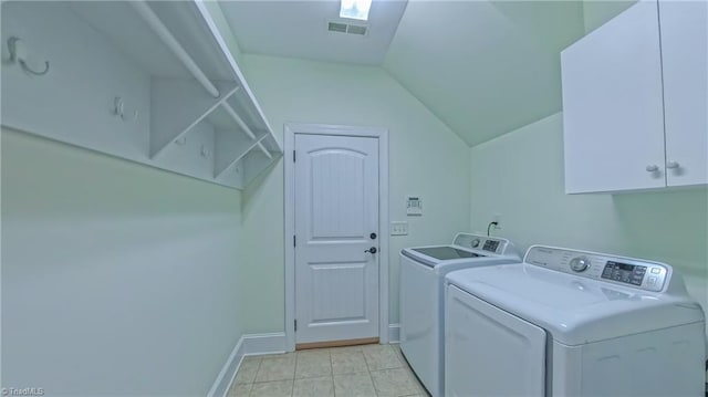 5567 Foxgate Cir, Winston-Salem, NC 27106 - washroom featuring washer and dryer, cabinet space, and light tile patterned floors