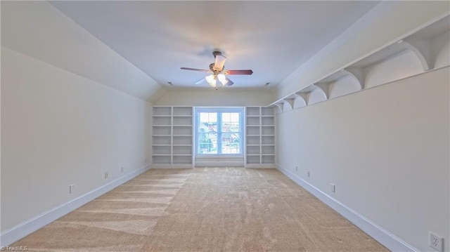 5567 Foxgate Cir, Winston-Salem, NC 27106 - empty room with a ceiling fan, built in shelves, light carpet, and lofted ceiling