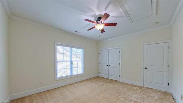 5567 Foxgate Cir, Winston-Salem, NC 27106 - unfurnished bedroom featuring attic access, crown molding, light colored carpet, a closet, and a ceiling fan