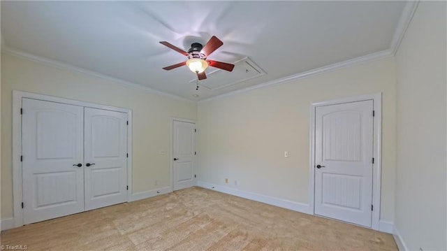 5567 Foxgate Cir, Winston-Salem, NC 27106 - unfurnished bedroom with attic access, crown molding, light colored carpet, ceiling fan, and a closet