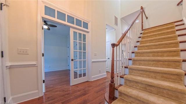 5567 Foxgate Cir, Winston-Salem, NC 27106 - entrance foyer featuring wood finished floors, stairs, french doors, and a ceiling fan