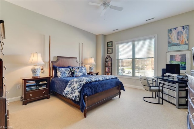 carpeted bedroom with a ceiling fan, baseboards, and visible vents