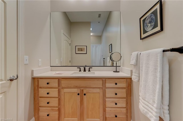 bathroom with visible vents and vanity