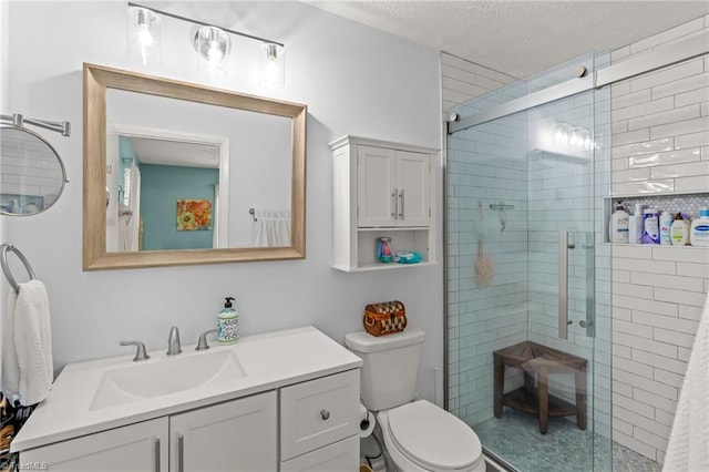 2664 Old Thomasville Rd, Winston-Salem, NC 27107 - bathroom featuring a shower stall, vanity, and a textured ceiling