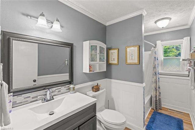 2664 Old Thomasville Rd, Winston-Salem, NC 27107 - bathroom with vanity, wood finished floors, decorative backsplash, a wainscoted wall, and a textured ceiling