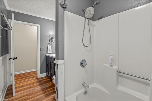 2664 Old Thomasville Rd, Winston-Salem, NC 27107 - bathroom with ornamental molding,  shower combination, wood finished floors, vanity, and a textured ceiling