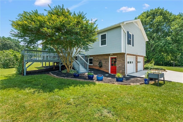 2664 Old Thomasville Rd, Winston-Salem, NC 27107 - view of front of house featuring an attached garage, concrete driveway, stairs, brick siding, and a wooden deck