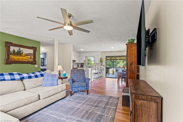 2664 Old Thomasville Rd, Winston-Salem, NC 27107 - living area featuring ceiling fan, a textured ceiling, and wood finished floors