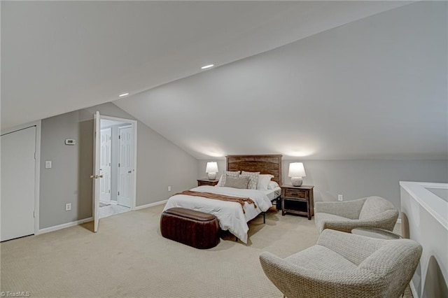 bedroom featuring carpet flooring, lofted ceiling, and baseboards