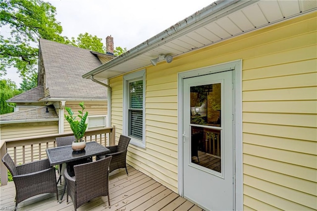 deck featuring outdoor dining area